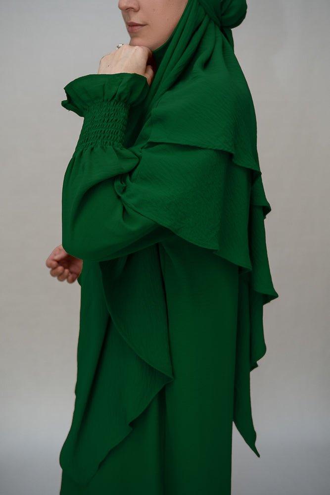 Sleeve details of the dark green modest dress by Annah Hariri