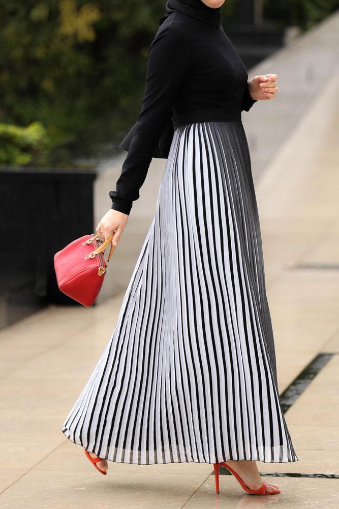 Full-length view of the Elegant Accordion Pleats Maxi Dress by Annah Hariri