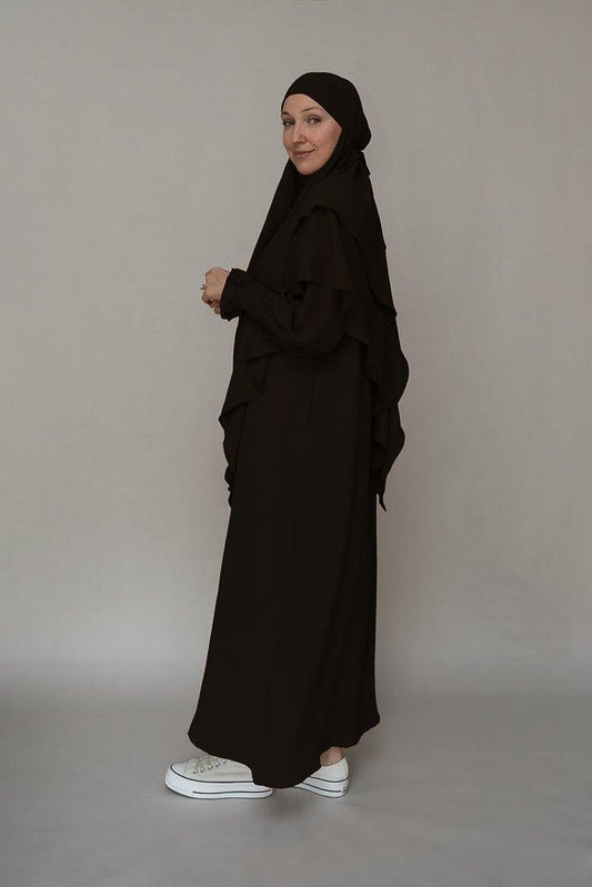 Front view of the elegant black abaya dress by Annah Hariri