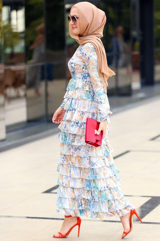 Side view of floral chiffon modest ruffle dress with layered skirt