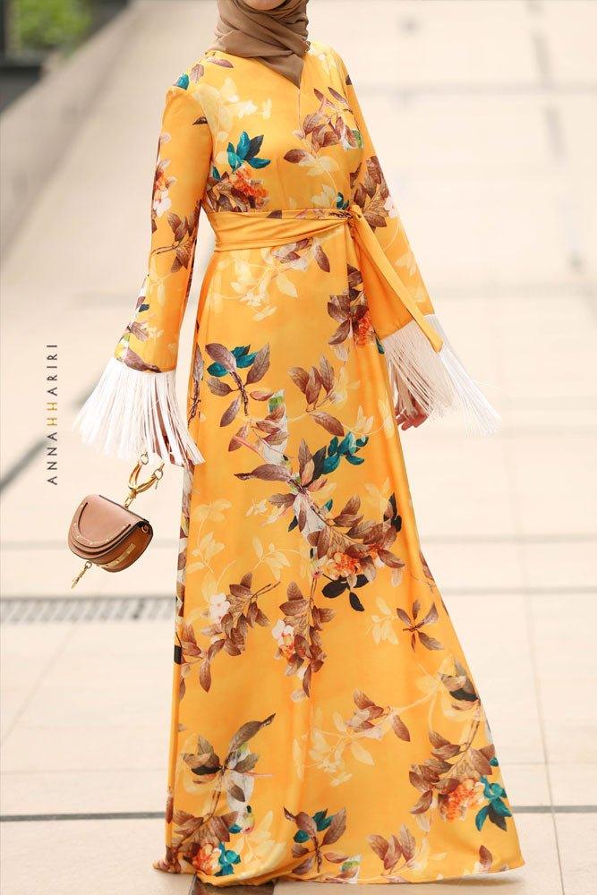 Side view of floral satin galabiya maxi dress with wide flared sleeves