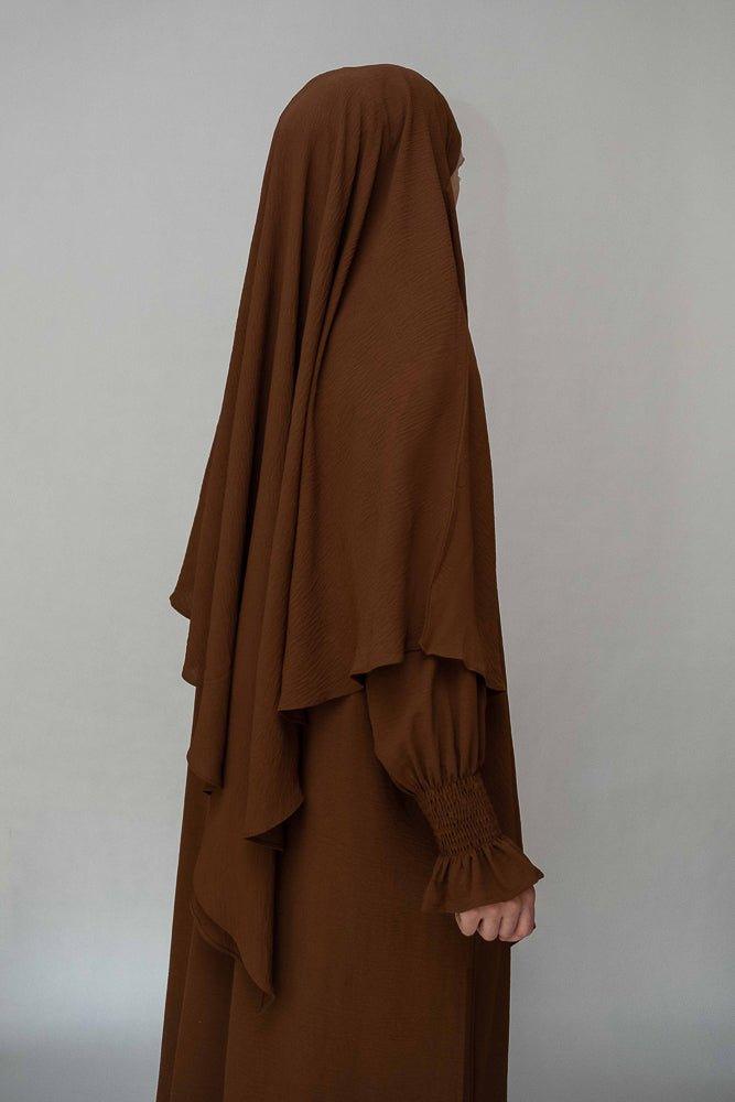 Angled front view of Kalean Travel Abaya Dress in coffee color