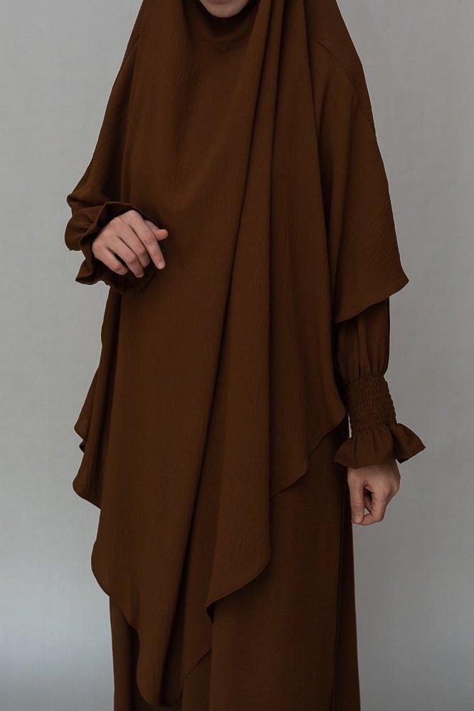 Kalean Travel Abaya Dress in coffee packed in a suitcase