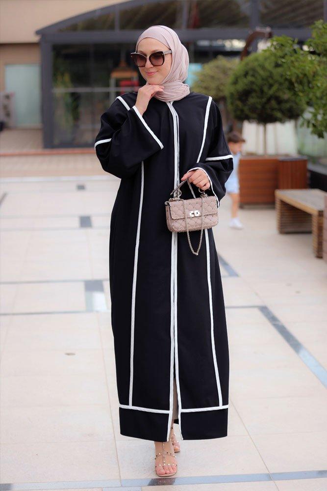 Front view of the Modern Black Abaya with white trims from Annah Hariri