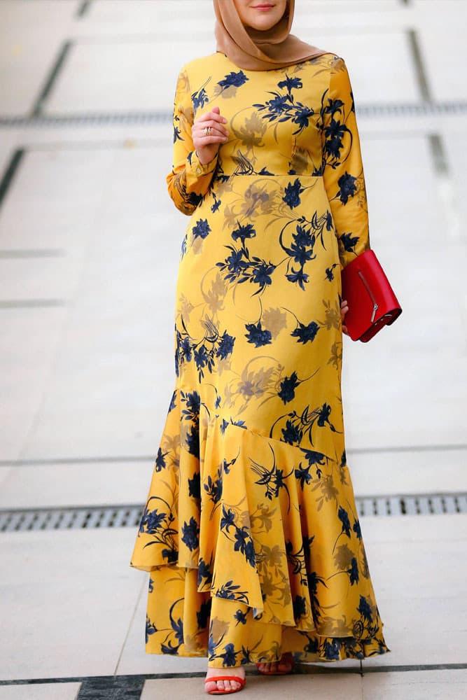 Side view showcasing the flowing design of the Radiant Yellow Floral Satin Maxi Dress